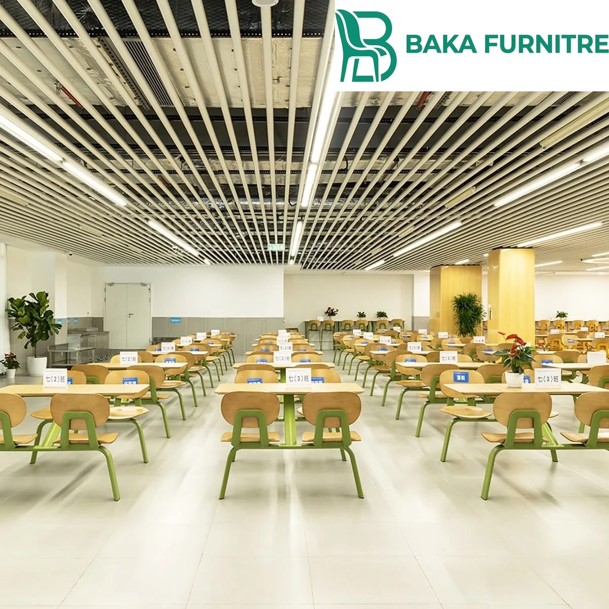 Counter-height stools and narrow wall tables in a cafeteria perimeter seating zone, project view 3